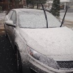light dusting of snow on car with windshield wipers up