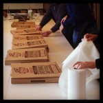 board room table filled with pizza boxes for lunch
