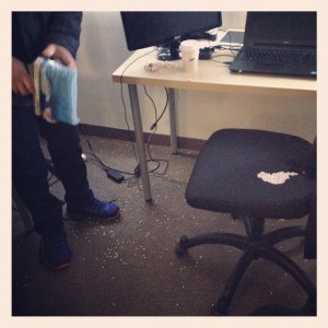 white bb gun pellets scattered across floor and office chair
