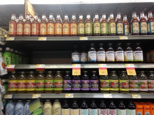 variety of bottled teas on shelf at store, with large gap where inko's tea flavors are