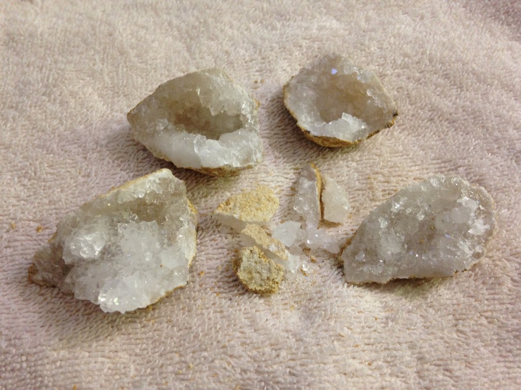 geode broken into four large pieces and a pile of small pieces