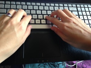 hands on keyboard typing with left thumb as primary on space bar