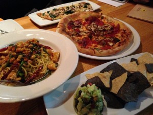 plates of dishes from california pizza kitchen