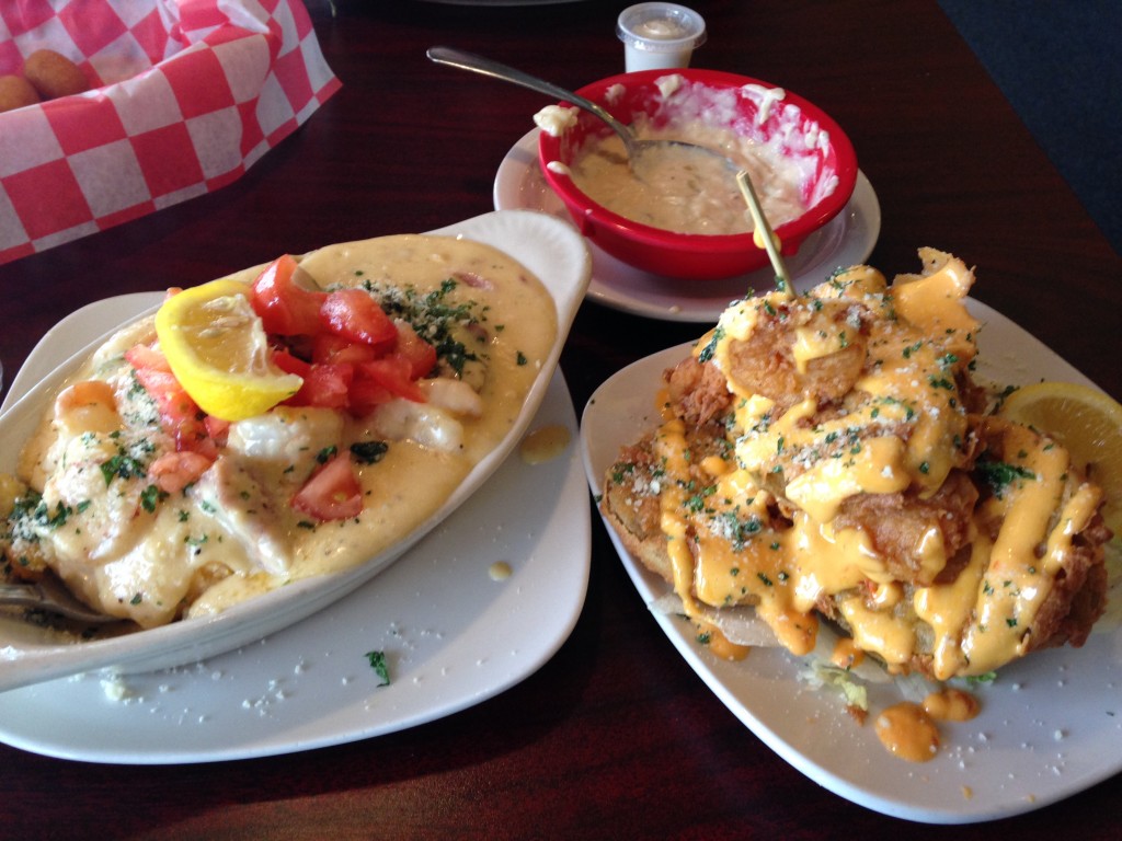 shrimp and grits, fried green tomatoes, hush puppies, and she crab soup at mr. fish