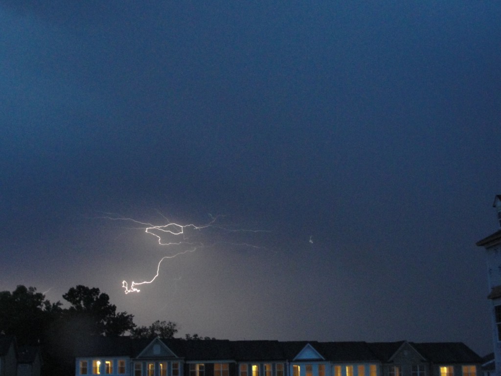 curling lightning bolt in dark sky