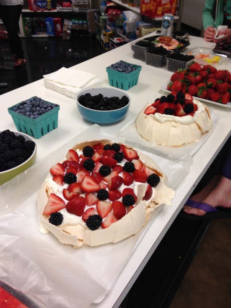australian pavlova desserts, blackberries, blueberries, cherries, and other fruit for office happy hour