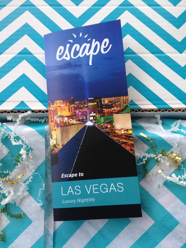 escape monthly june las vegas box info card against blue and white chevron background