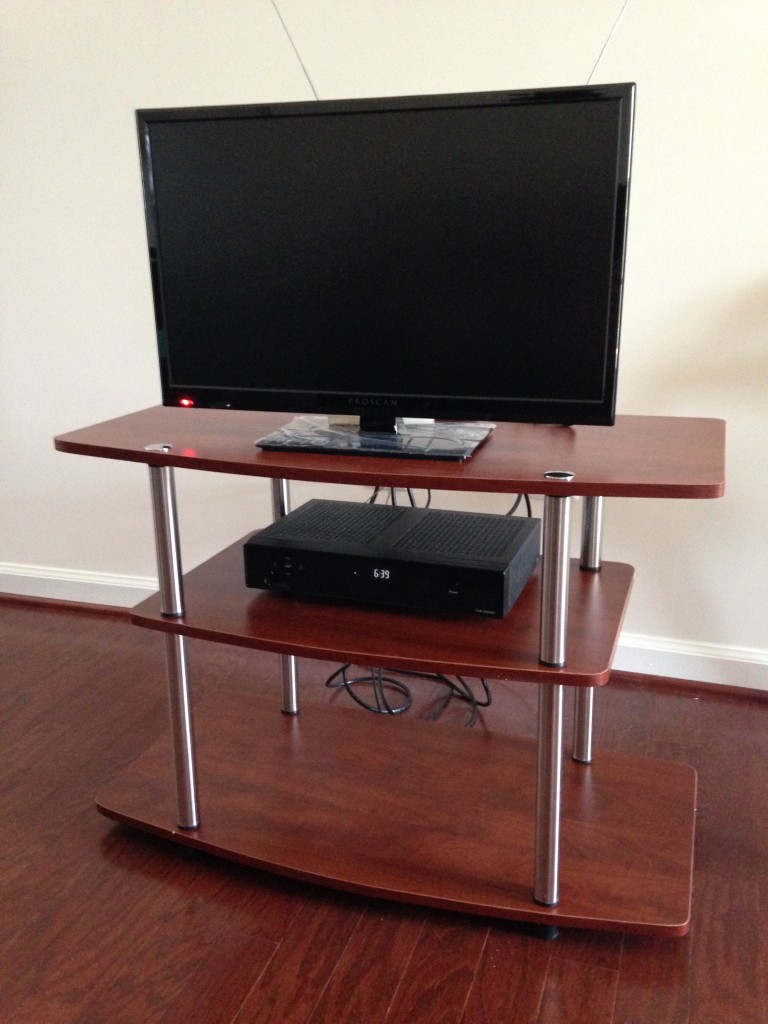 new tv stand with tv and cable box set up