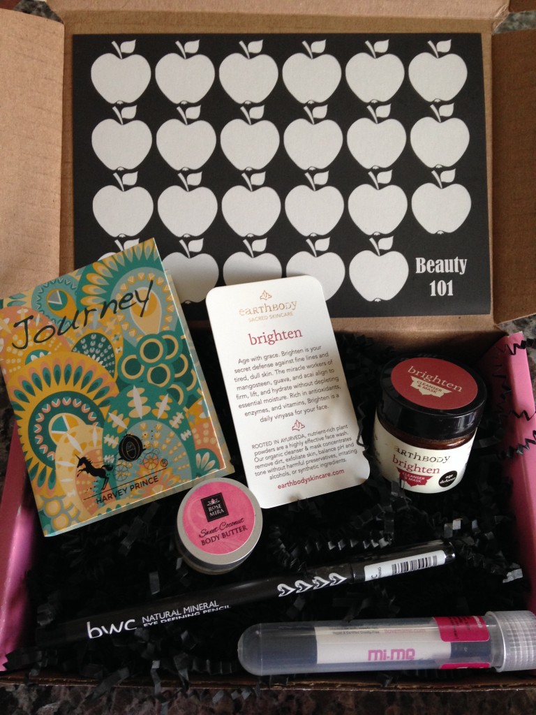 contents of petit vour august 2014 box with beauty without cruelty eye pencil, earth body cleanser and mask, harvey prince fragrance, mi-me lip butter, rosemira body butter, and info card with beauty 101 theme