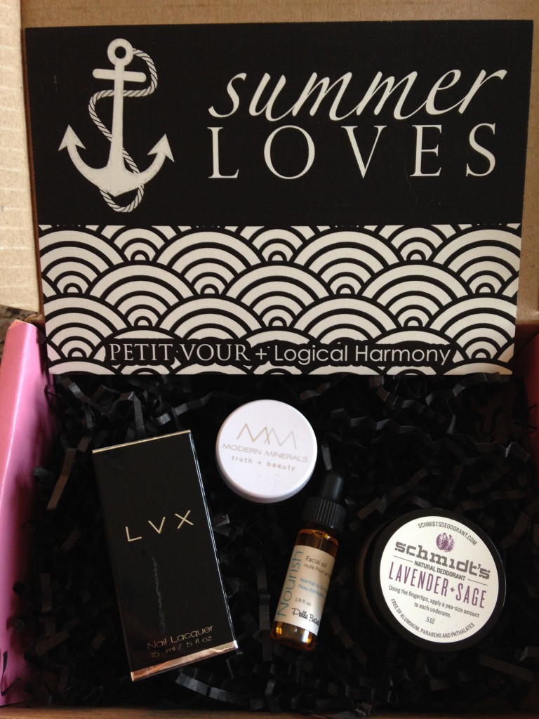 contents of petit vour july 2014 box with lvx nail lacquer, modern minerals eye shadow, pelle beauty facial oil, schmidt's natural deodorant, and info card with summer loves set sail theme