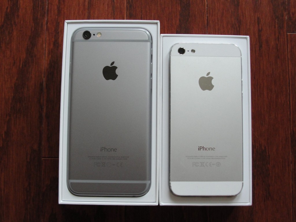 backs of iphone 6 and iphone 5 in boxes