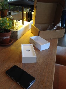 iphone 6 and boxes being opened at vapiano's