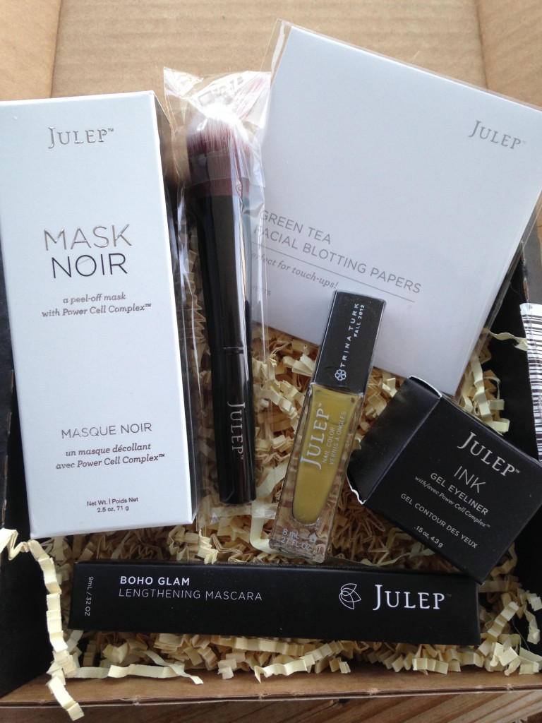 julep jewel heist mystery box contents including mask noir, double duty makeup brush, green tea blotting papers, gel eyeliner, lengthening mascara, and polish in alma