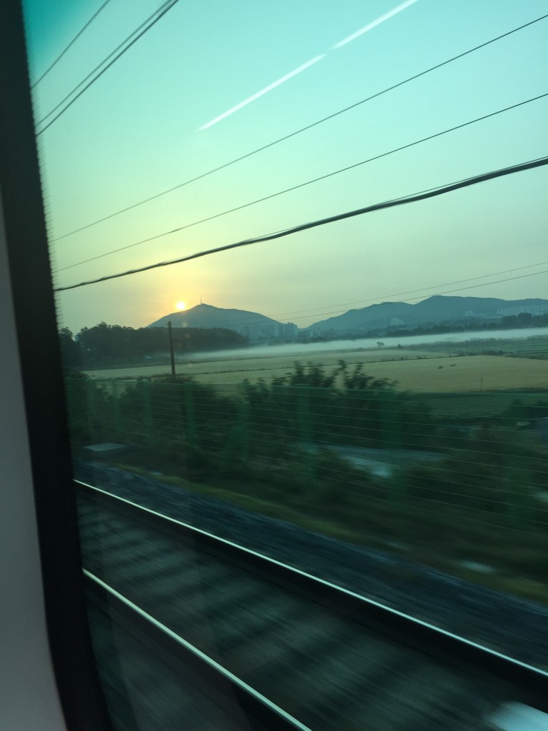 view of sunrise from arex airport express connecting incheon airport to seoul station