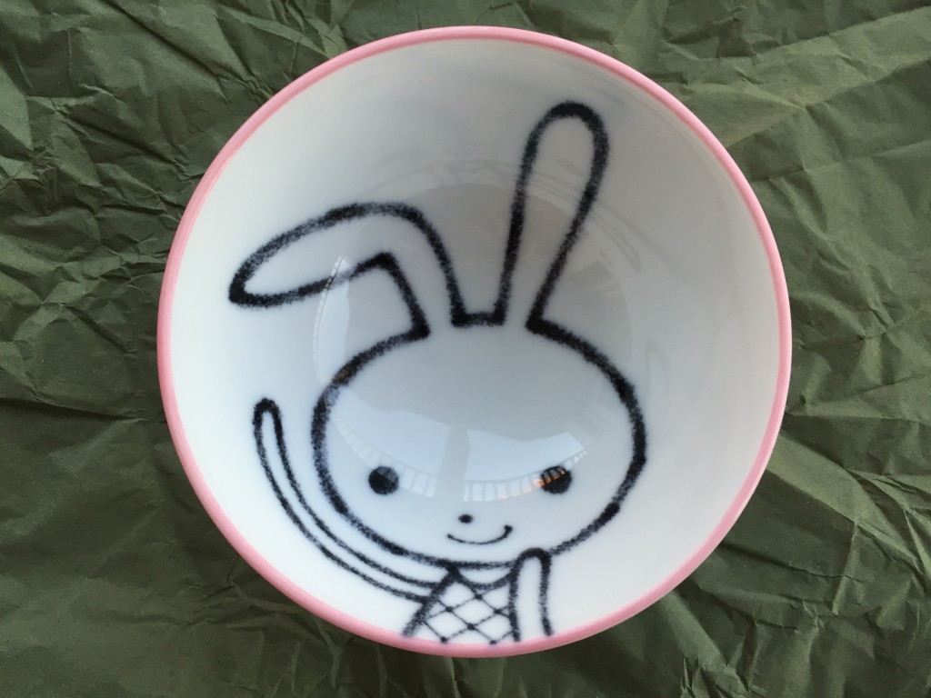 small bowl with cartoon bunny design inside