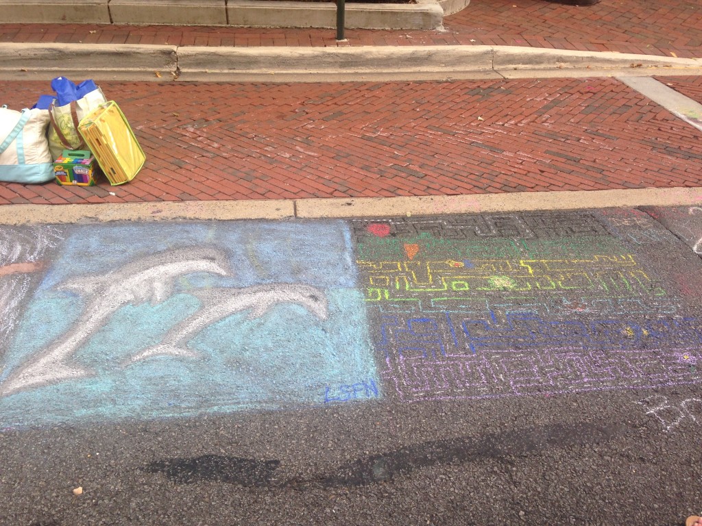 chalkfest reston chalk art drawing of dolphins and maze