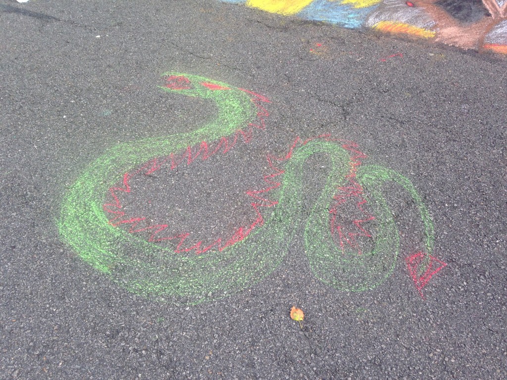 chalkfest reston chalk art drawing of green and red snake or dragon