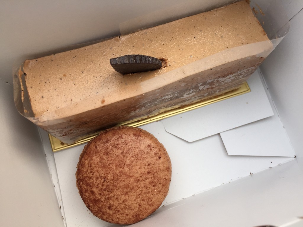 slice of mcdonald's earl grey cake and chocolate macaron