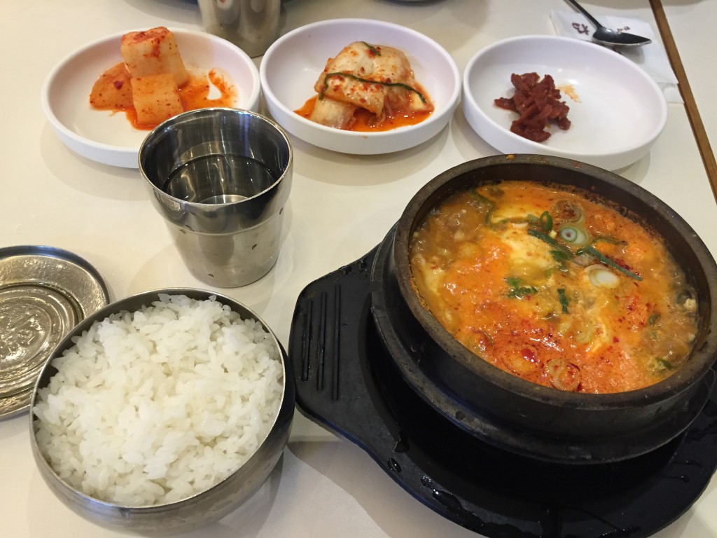 korean tofu soup and sides for breakfast at seoul station