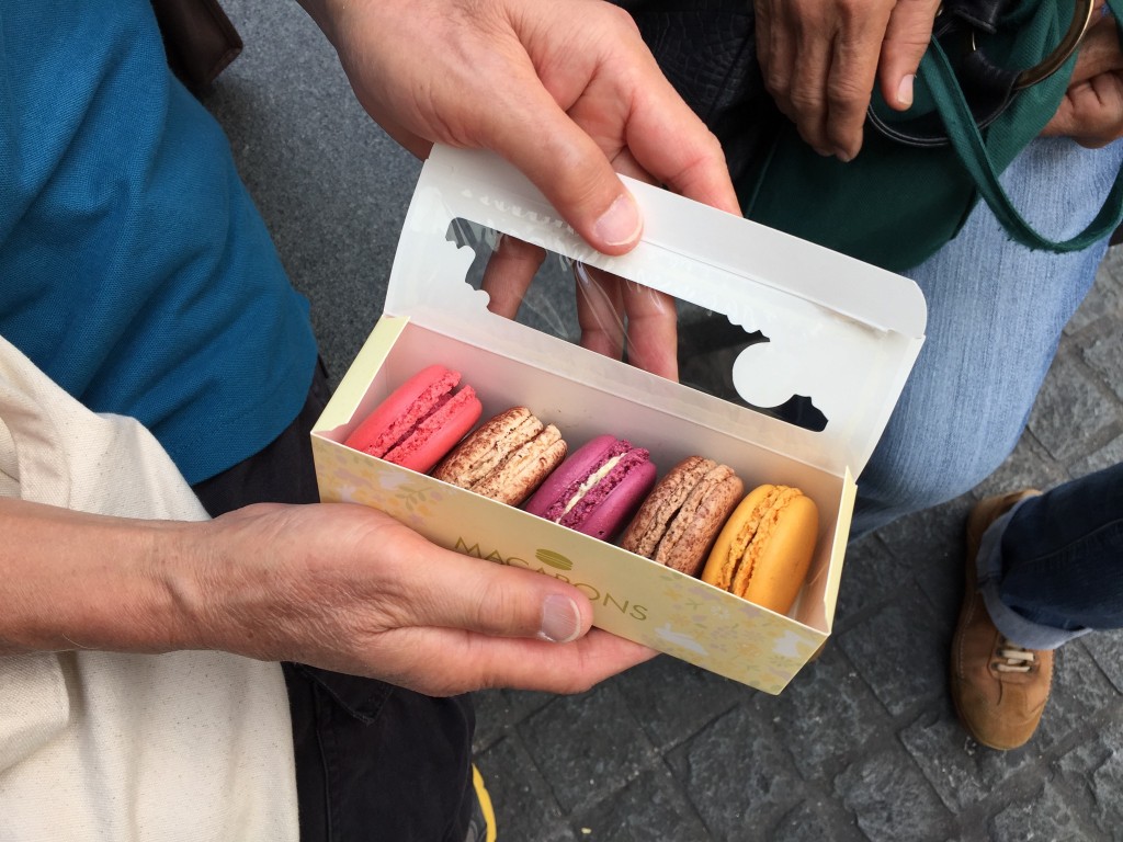 boxed set of mcdonald's macarons in five flavors: raspberry, chocolate, passionfruit, coffee, and mango
