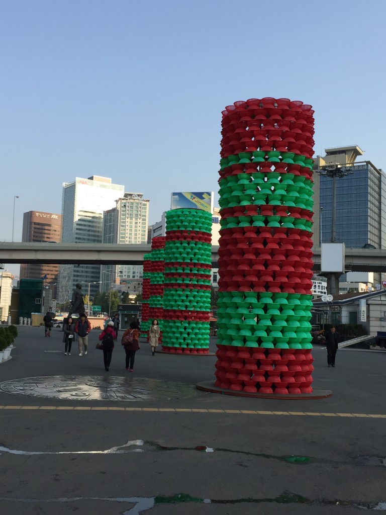 plastic columns of red and green baskets outside of seoul station