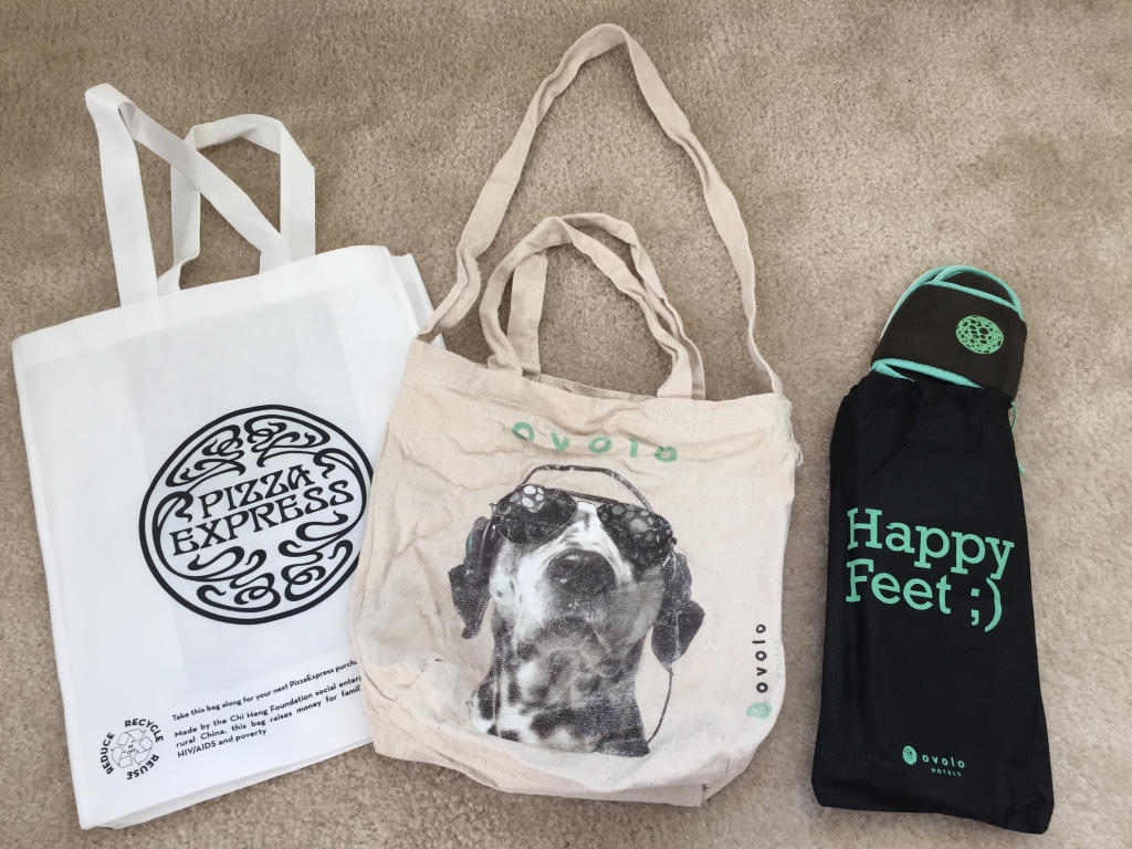 pizza express bag, ovolo hotels go bag, and drawstring bag with slippers inside