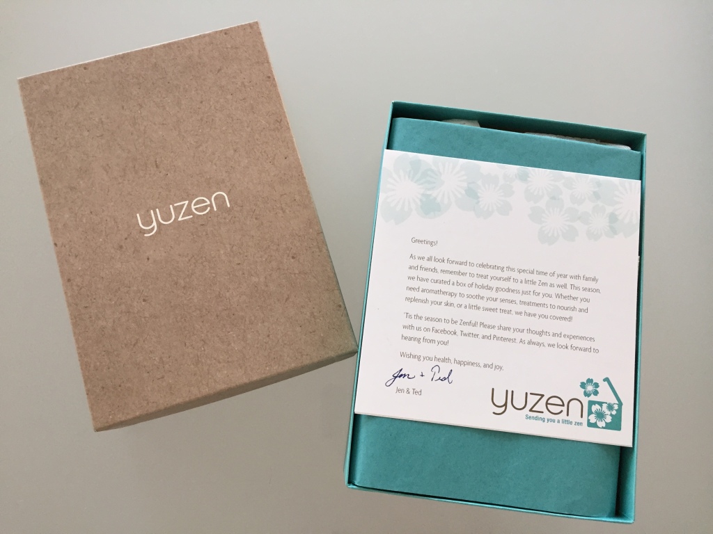 yuzen november-january 2014 winter box open with brown lid, card with welcome message, and teal tissue paper