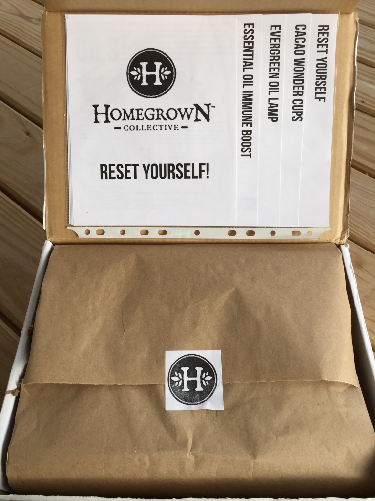 inside of reset yourself homegrown collective box with the info sheets on the inner lid