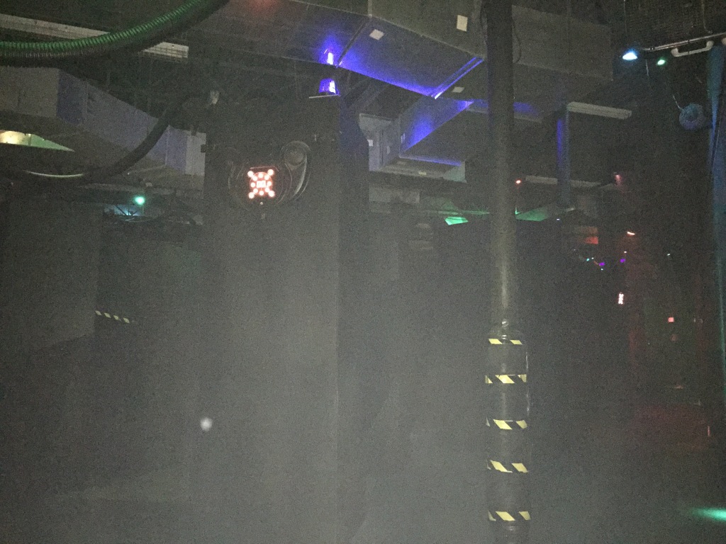 laser tag arena with everything painted black and glowing lights everywhere