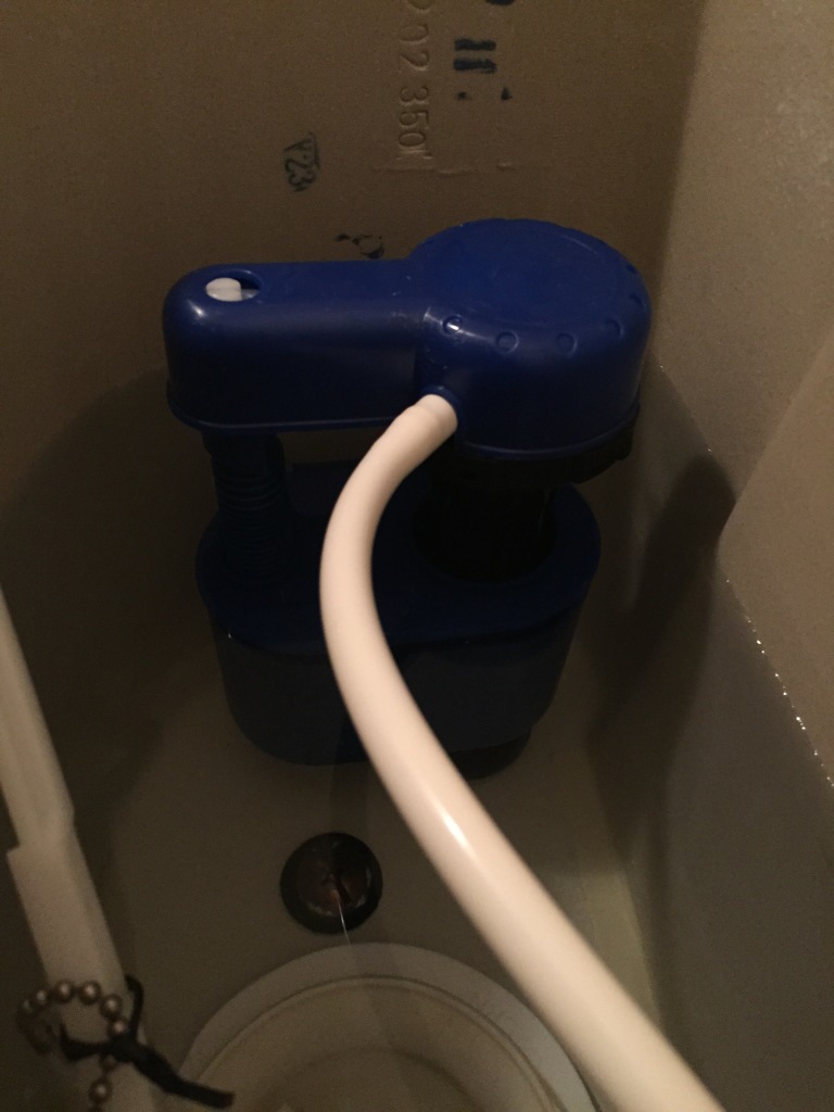 blue toilet float in toilet tank