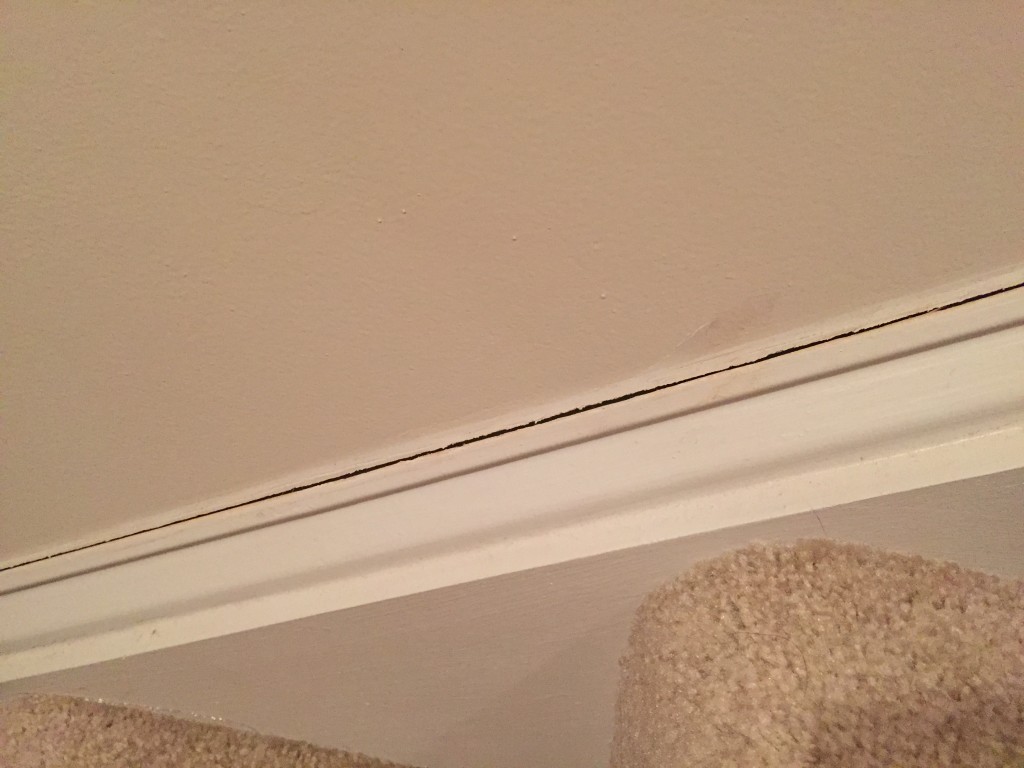 crack by stairs of home prior to caulking