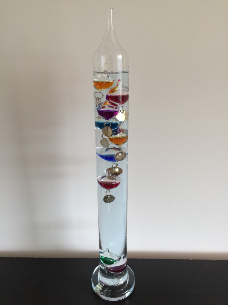 galileo thermometer tinted blue by broken globe inside