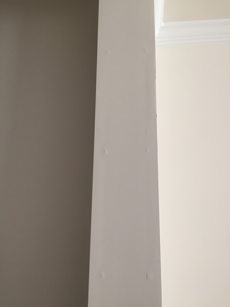 set of nails popping underneath drywall causing bumps