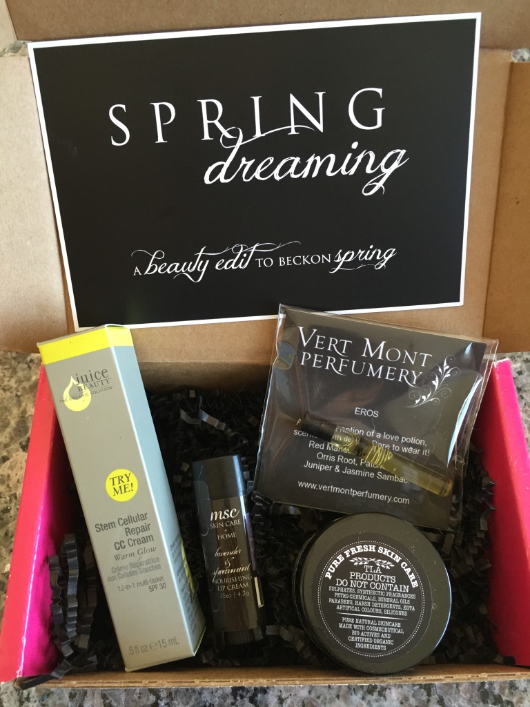 contents of petit vour march 2015 box with juice beauty cc cream, msc nourishing lip cream, vert mont perfumery fragrance, the little alchemist face glow, and info card with spring dreaming theme