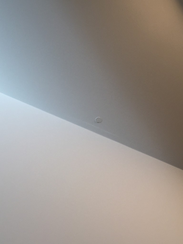 popped nail under drywall creating obvious dent
