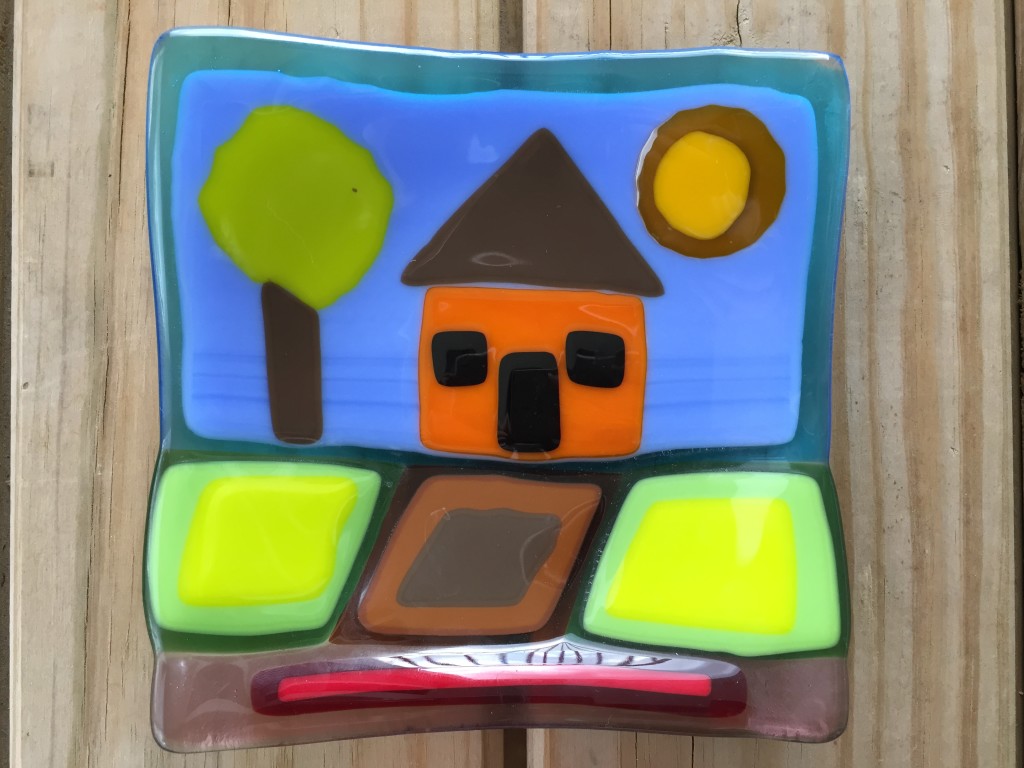 fused glass piece of house, tree, sun, driveway, and yard
