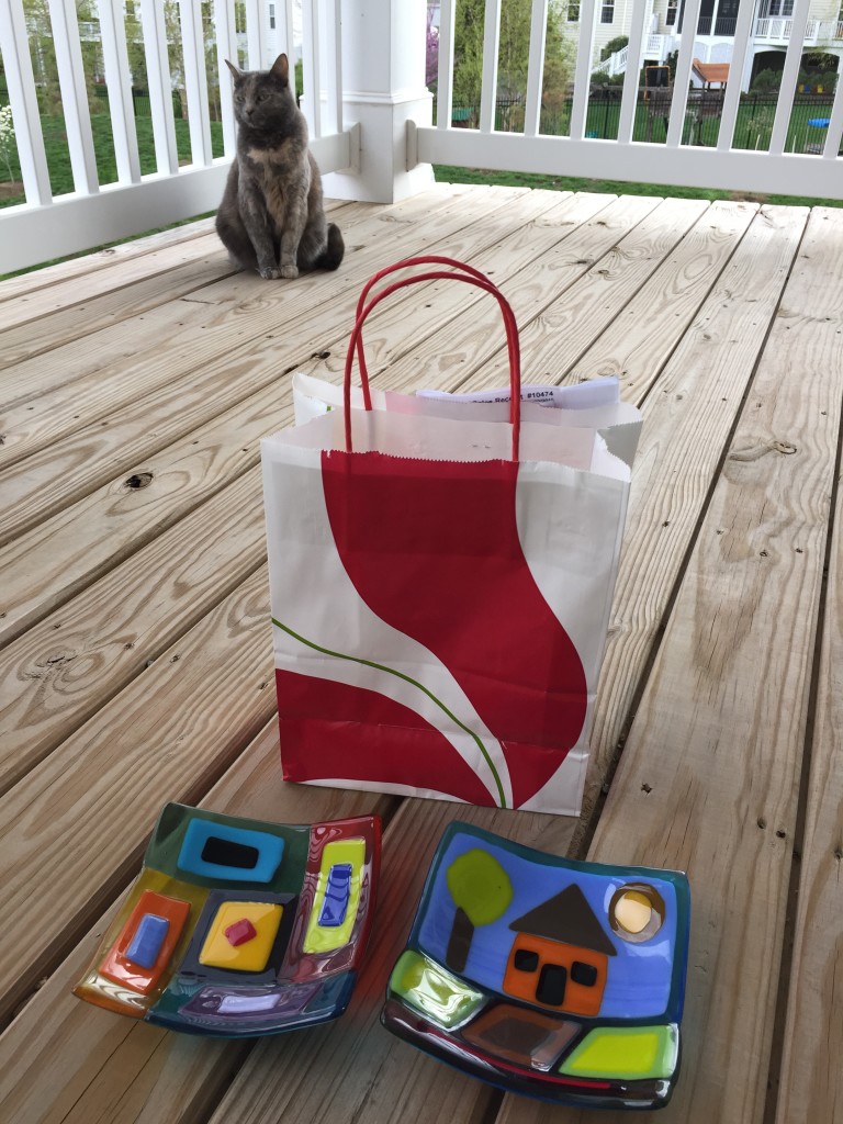 completed fused glass projects with gift bag and cat in background