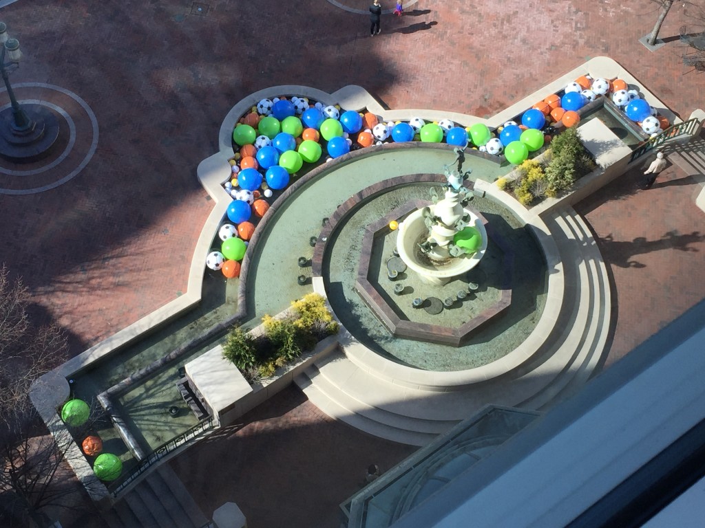 reston town center fountain filled with large plastic beach balls for april fool's