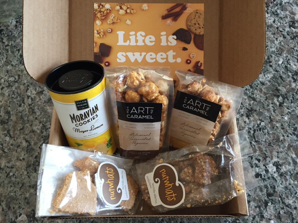 treatsie june 2015 box contents with salem baking moravian cookies, the art of caramel artisanal caramelized popcorn, and nutwhats confection crunch