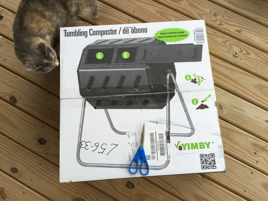 tumbling composter box with cat sniffing corner