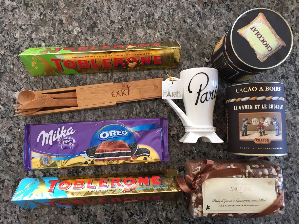 chocolate bars, bamboo utensils, mug, hot chocolate powder, and gingerbread from france