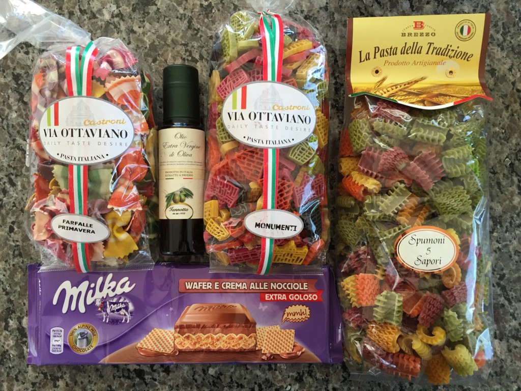 bags of pasta, bottle of olive oil, and bar of chocolate from italy