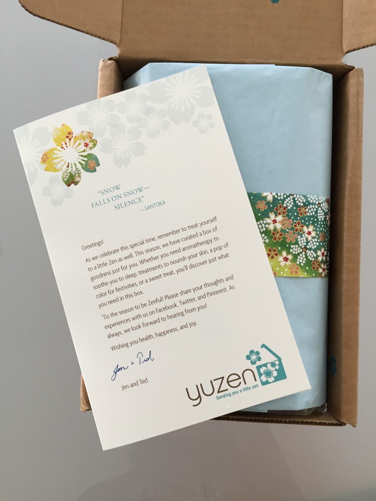 yuzen november-january 2015 winter box open with pale blue tissue paper, piece of yuzen paper and info card