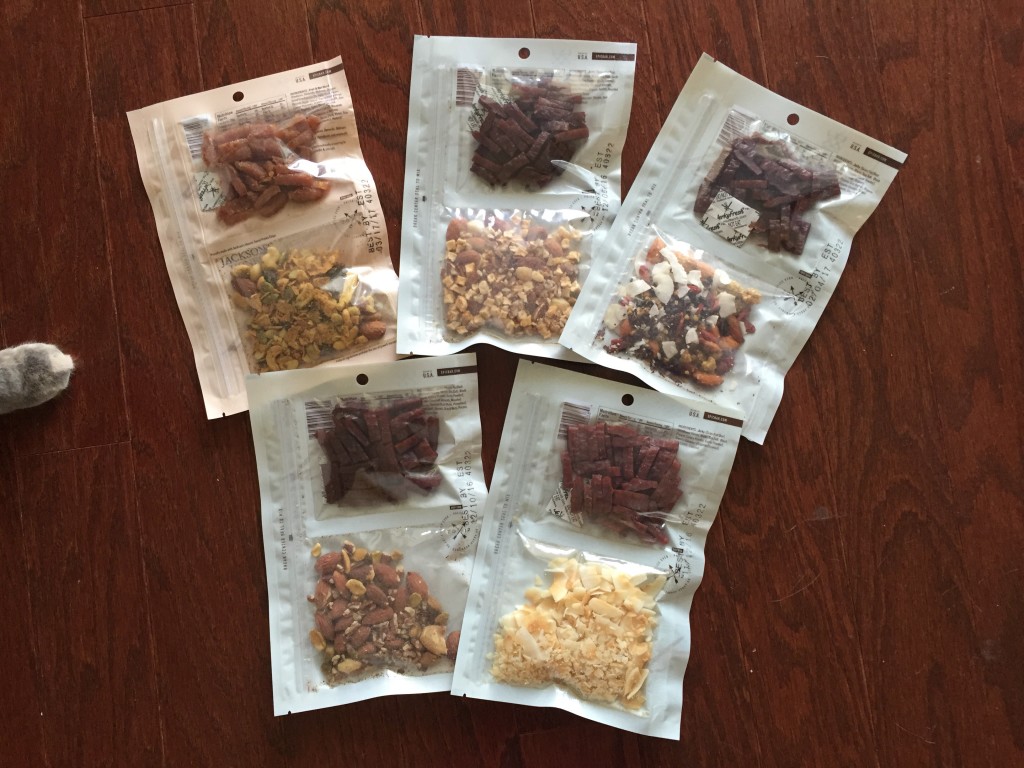 five assorted bags of epic jerky and trail mix