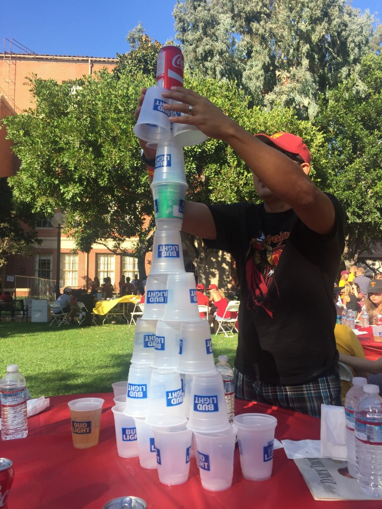 building plastic cup tower at tailgate party
