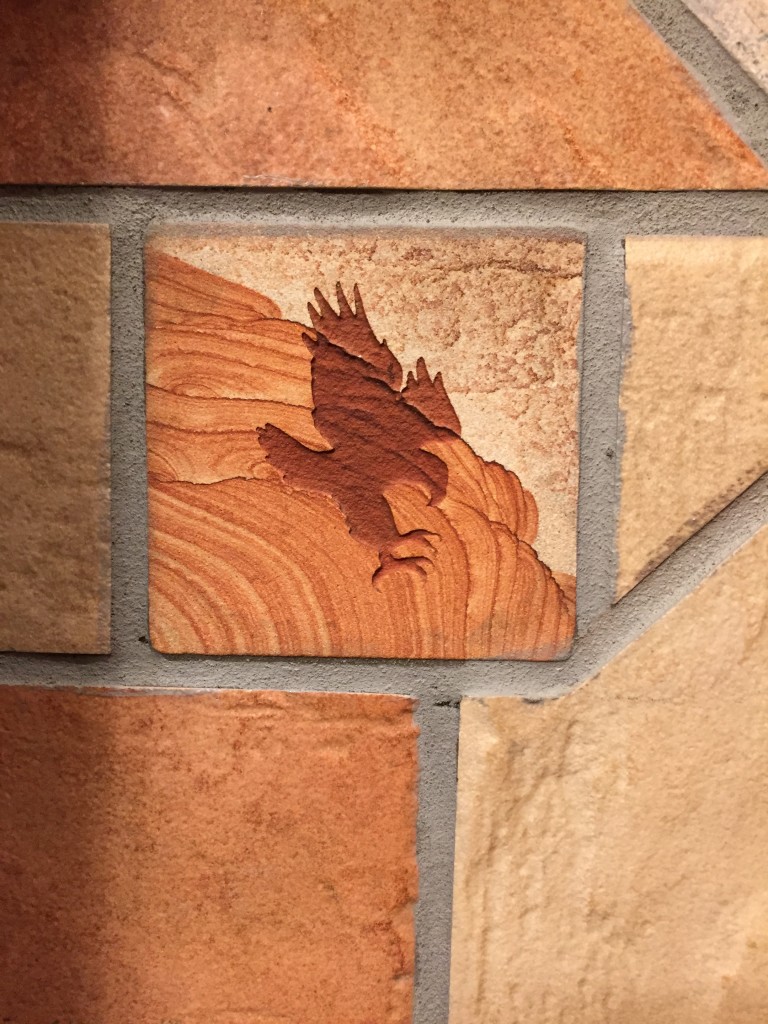 eagle decoration carved in stone tile of bathroom