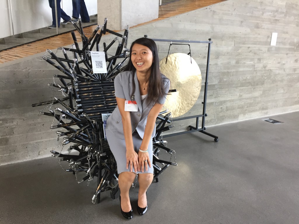 pretending to sit in nunchuck chair at adobe headquarters