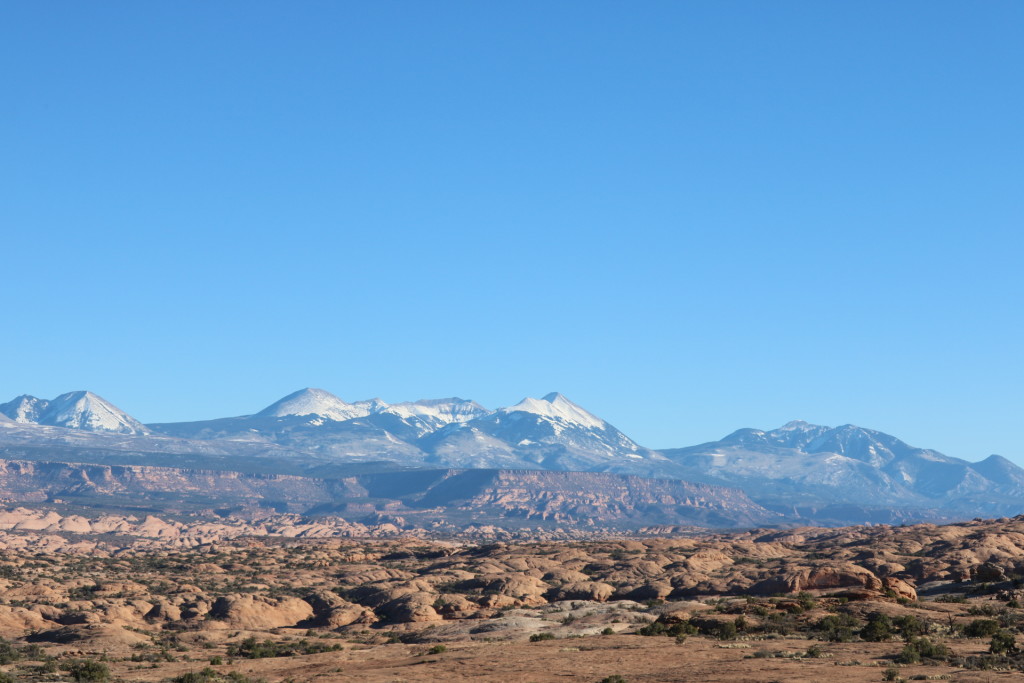snowy mountains against red rocks