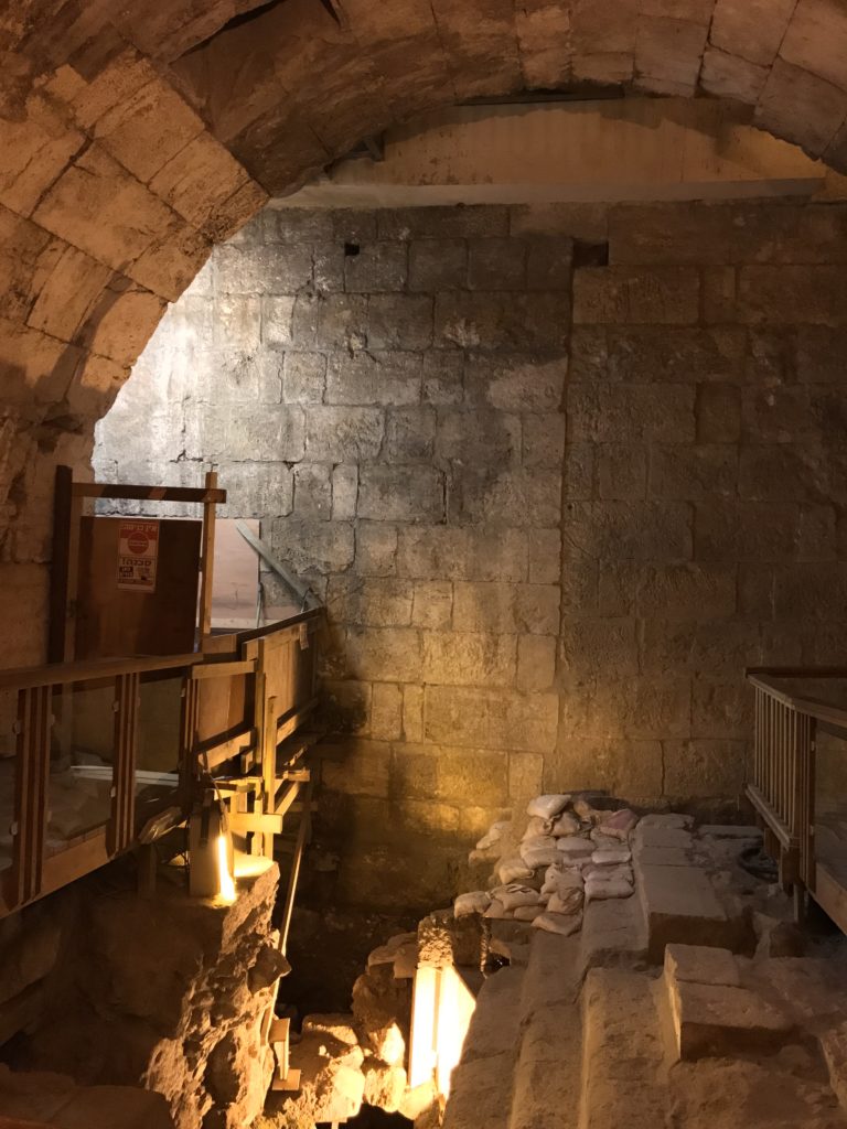 western wall tunnel under construction with empty bath