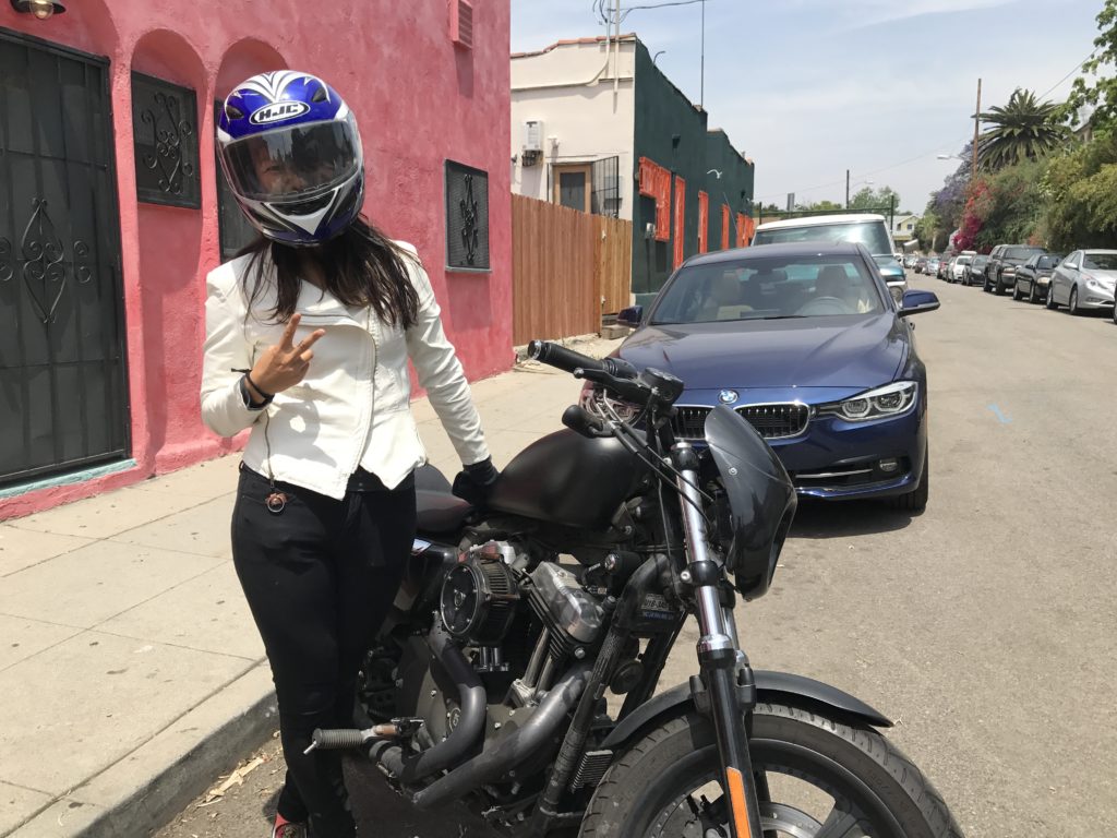standing by motorcycle